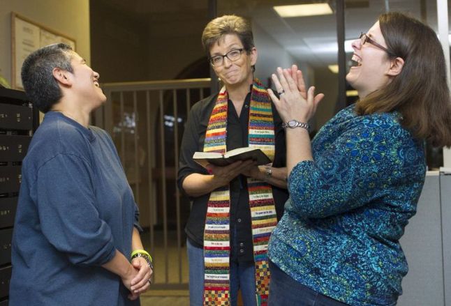 My friends Michelle and Karen - with the Rev. Julie Peeples officiating - were one of the first couples to wed once the ruling came down.